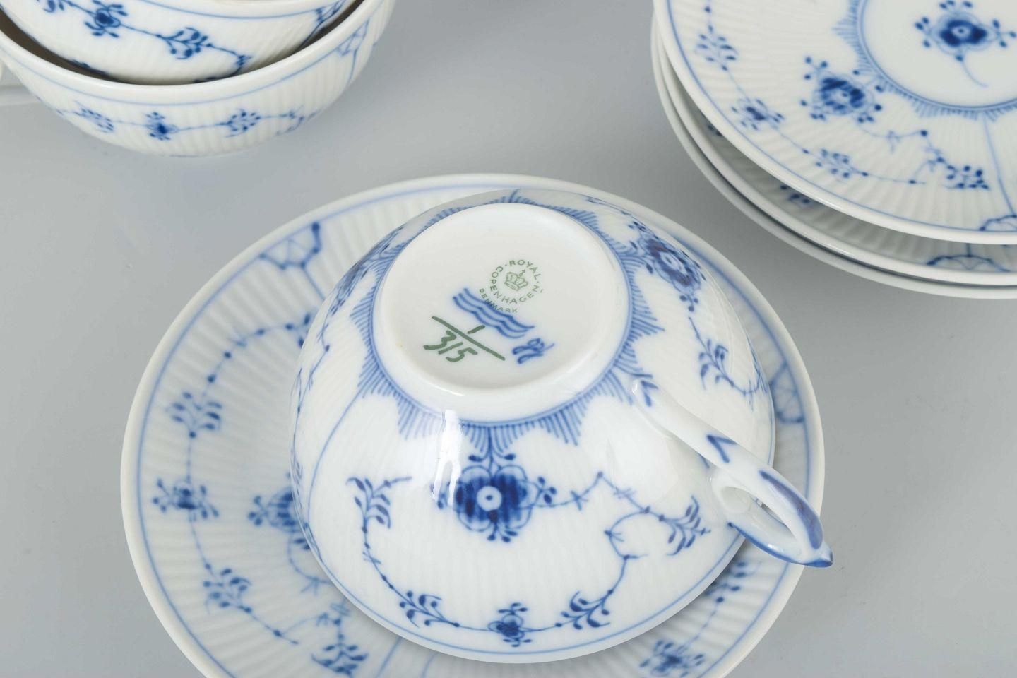 Royal Copenhagen Blue Fluted Plain. Set van vier theekopjes met bijpassende schoteltjes. photo Woonaccessoires