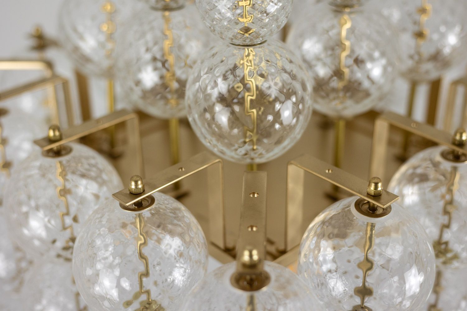 photo furniture Kamenicky Senov. Chandelier Made Of Blown Glass And Gilded Brass. 1970s.