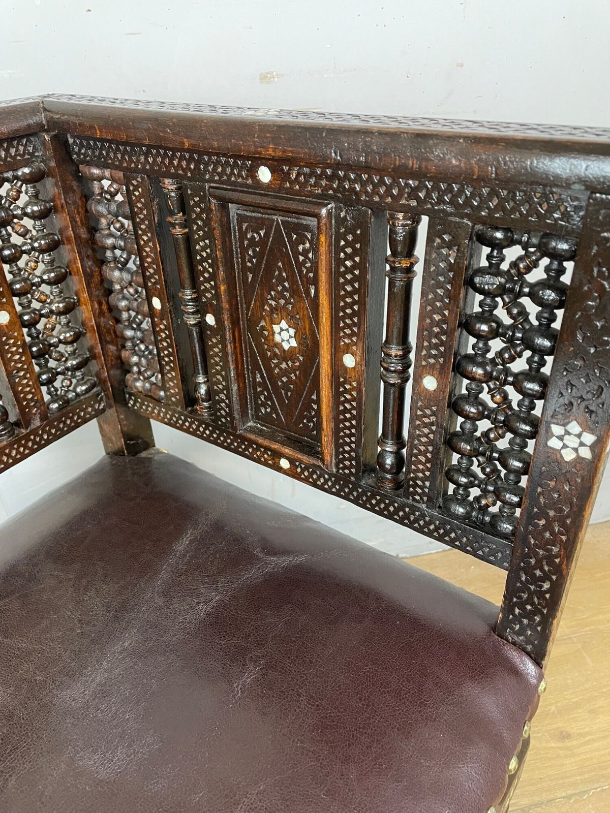 photo for sale C19th Inlaid Carved Corner Chair With Mashrabiya Panels Attributed To Liberty And Co