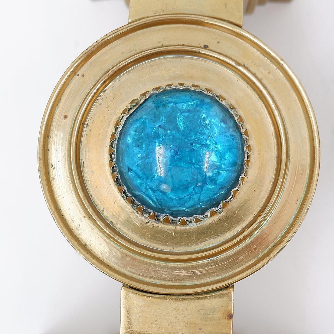 Pair Of Brass Candlesticks Decorated With A Blue Stone Inlaid In The Center photo for sale