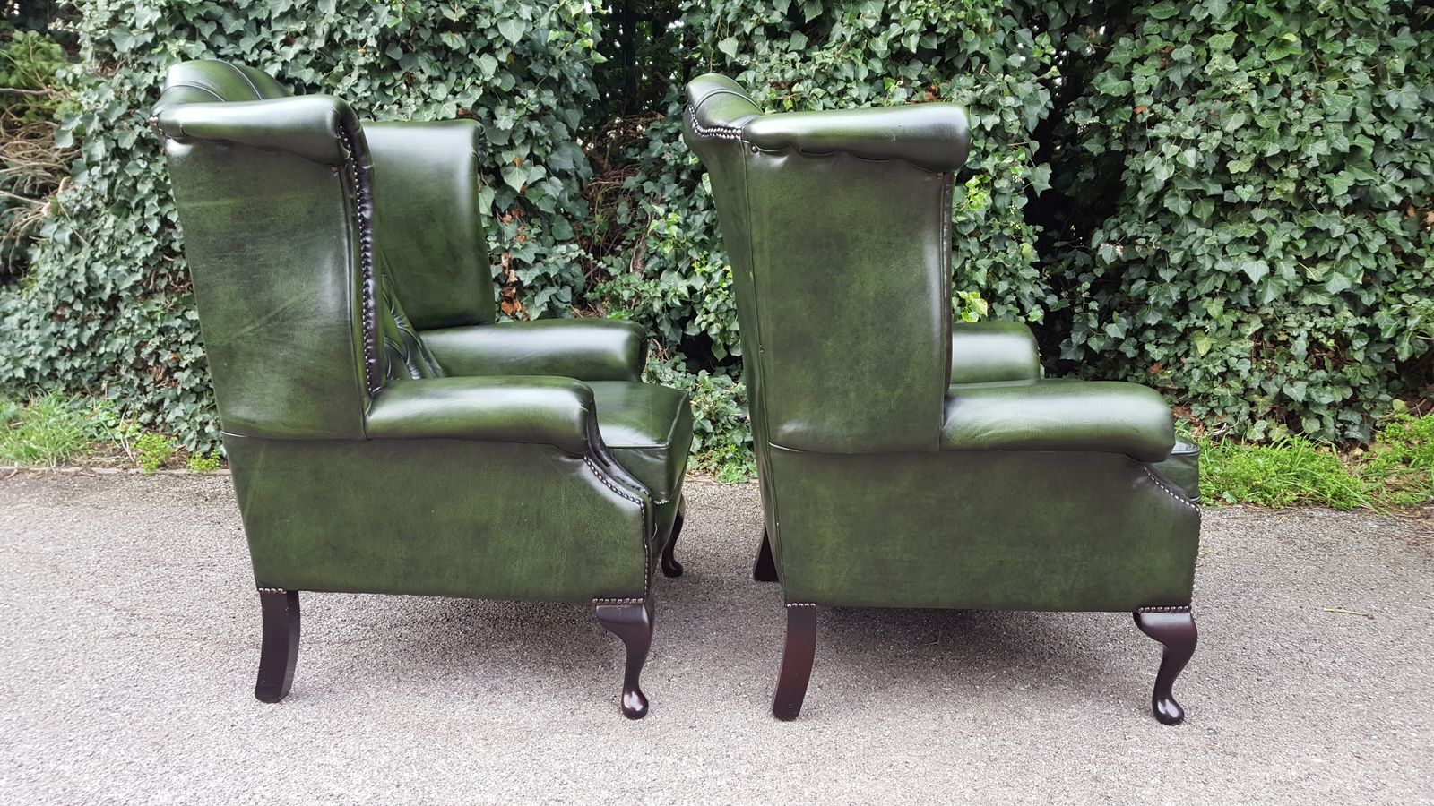 Matching Pair Of Mahogany Green Leather Chesterfield Wingback Armchairs photo for sale