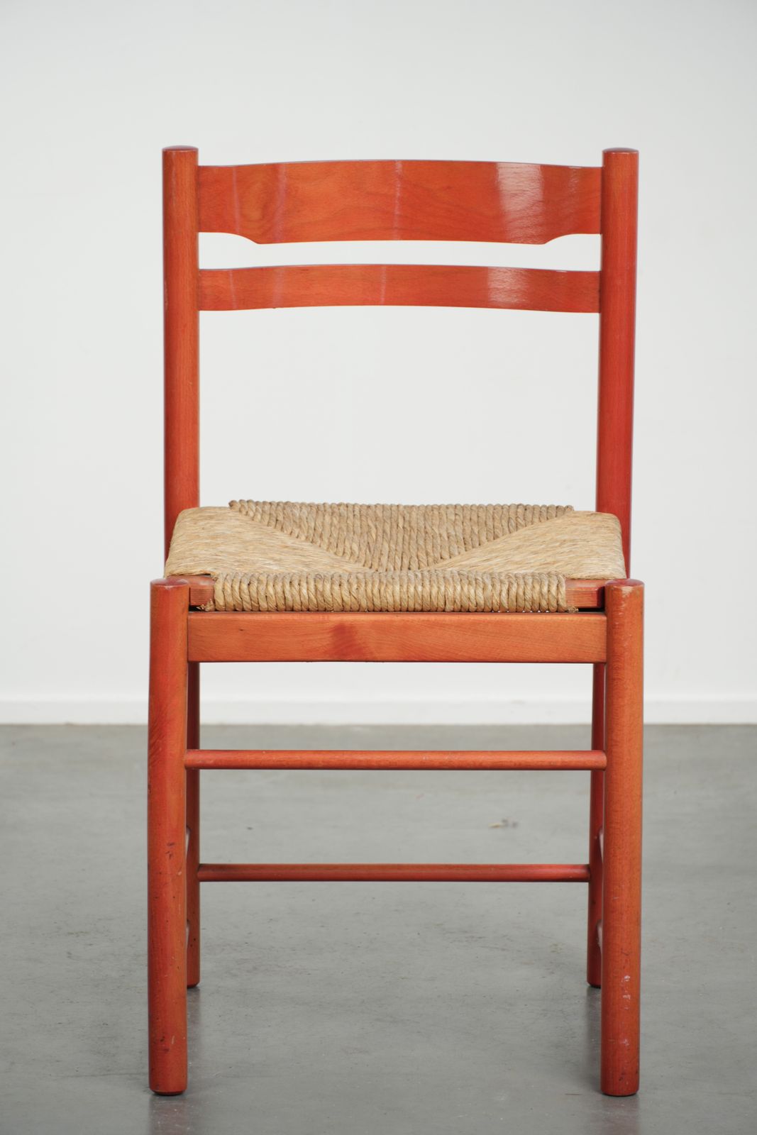 Cute Red Vintage Wooden Chair From The 70’s With A Braided Wicker Seat photo furniture