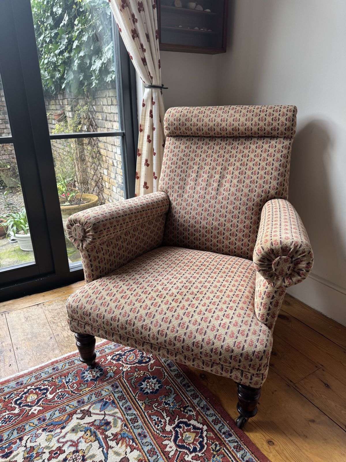 Antique Reupholstered Armchair On Mahogany Casters photo furniture