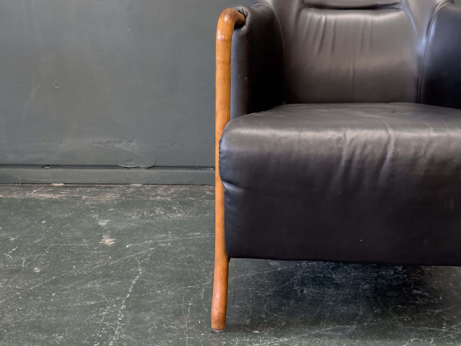 photo vintage 'Claudia' Black Leather And Beech Highback Armchair With Footstool By Stouby