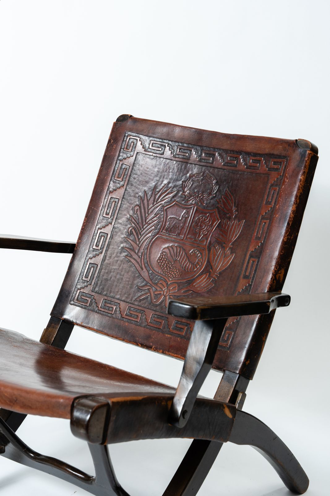 Angel Pazmiño – Hand Carved Crested Leather And Hardwood Folding Armchair/Chair (1960s–70s) photo furniture