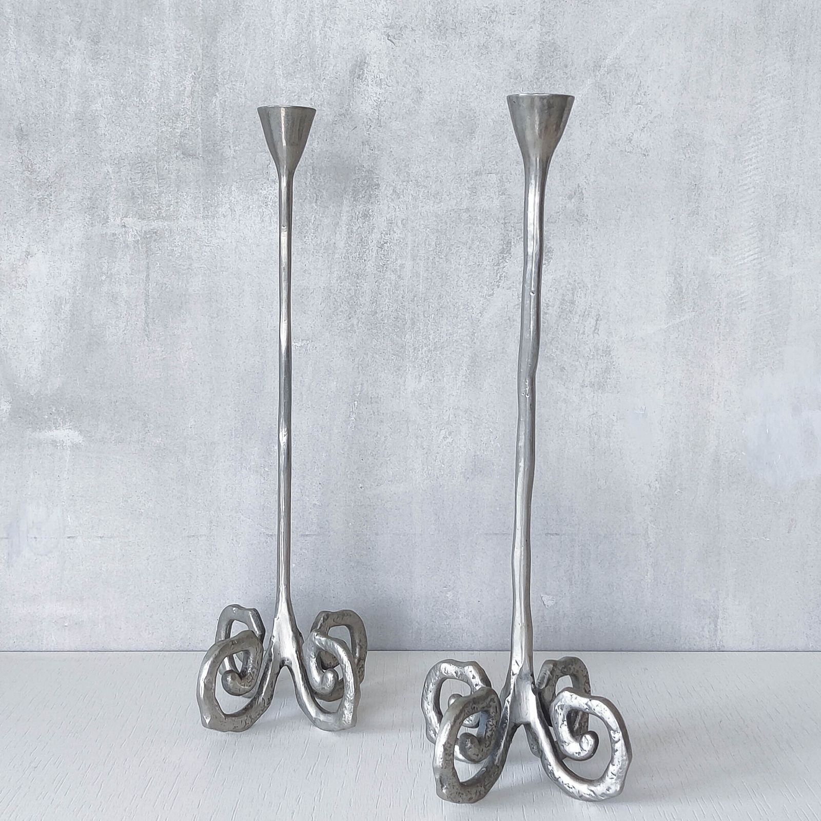 photo for sale Pair Of Vintage Cast Aluminium Candle Holders With Spiral Feet