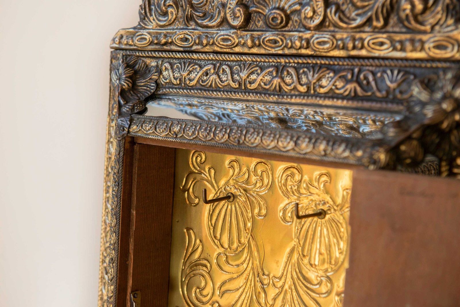 photo for sale Antique French Brass Mirror With Floral Crest – Ornate Repoussé Vanity Cabinet