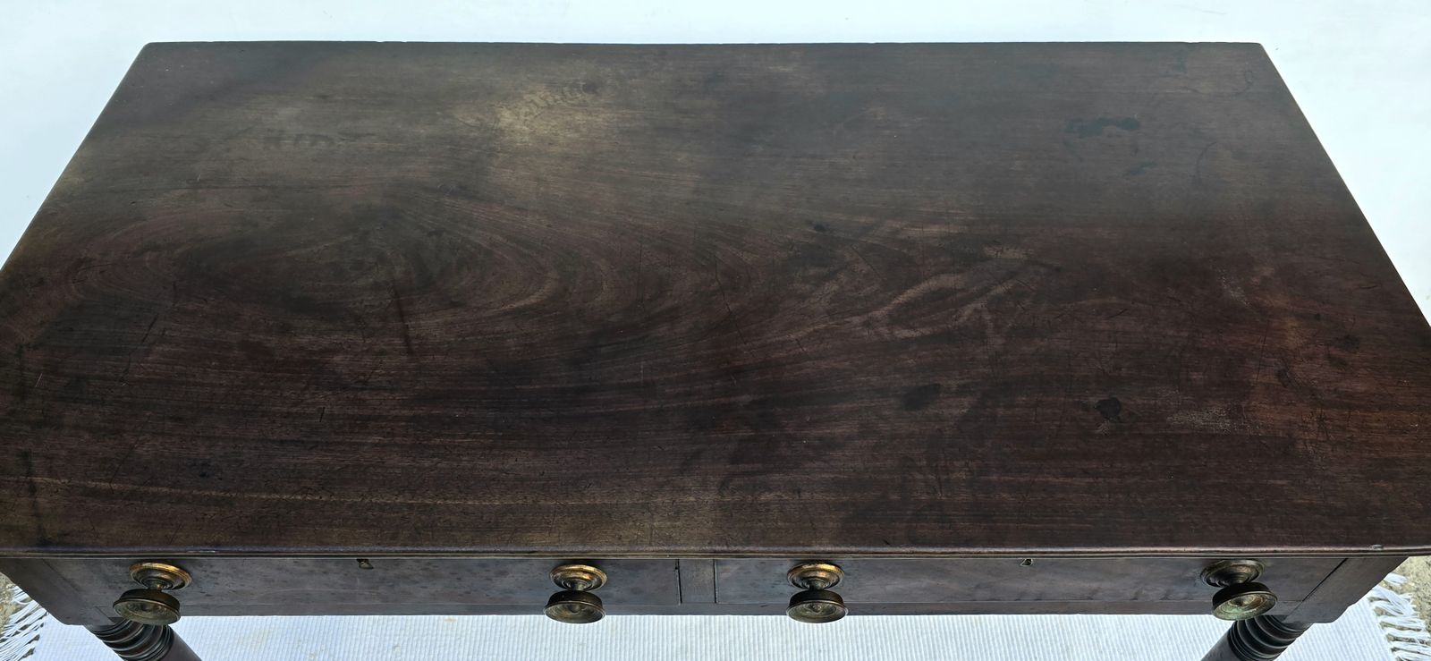 An Antique Regency Mahogany Writing Desk On Castors. photo vinterior