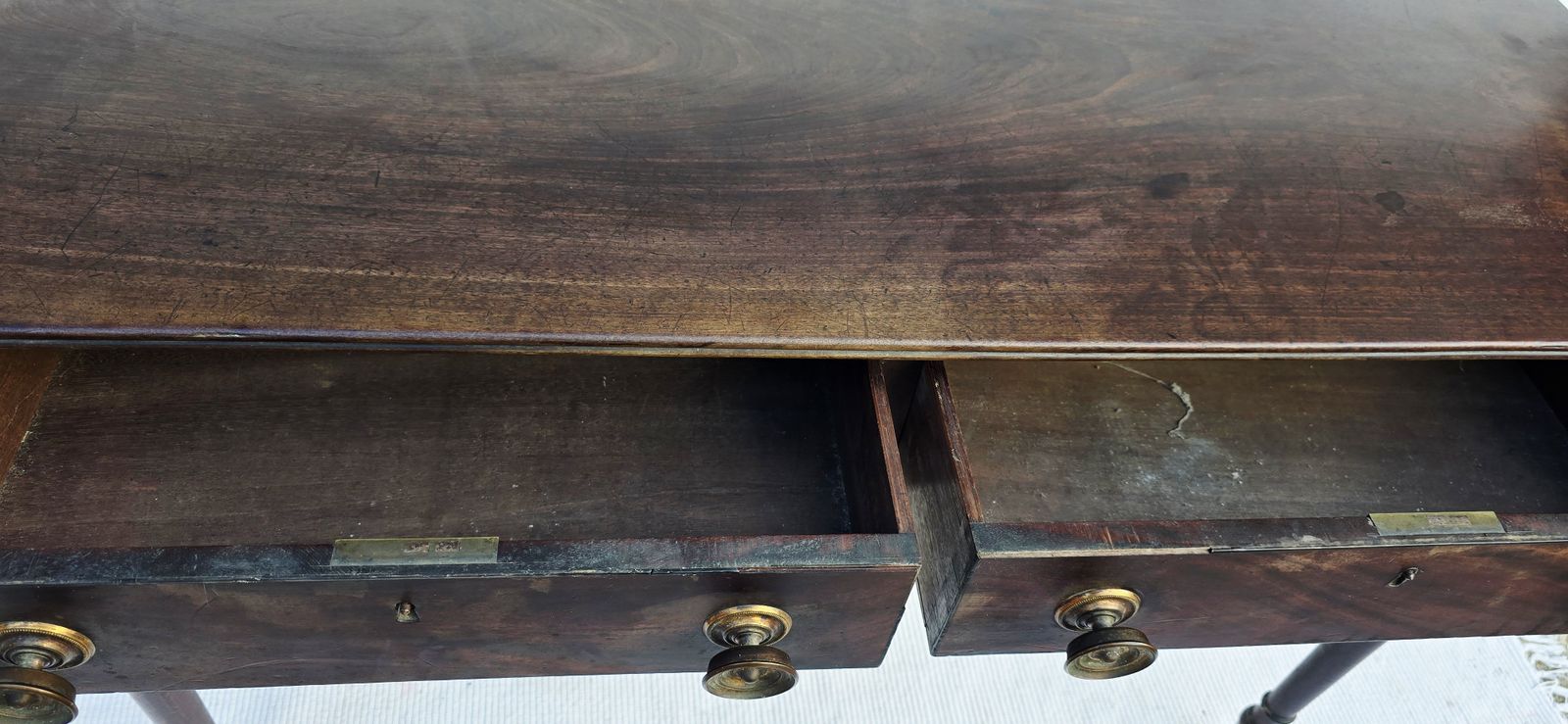 750.0 An Antique Regency Mahogany Writing Desk On Castors. photo