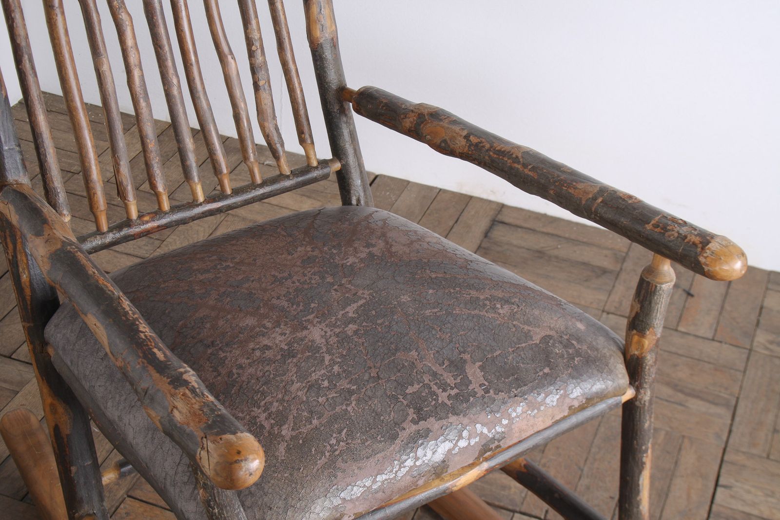 Antique American Stick Back Rocking Chair With Distressed Patina And Leather Seat photo for sale