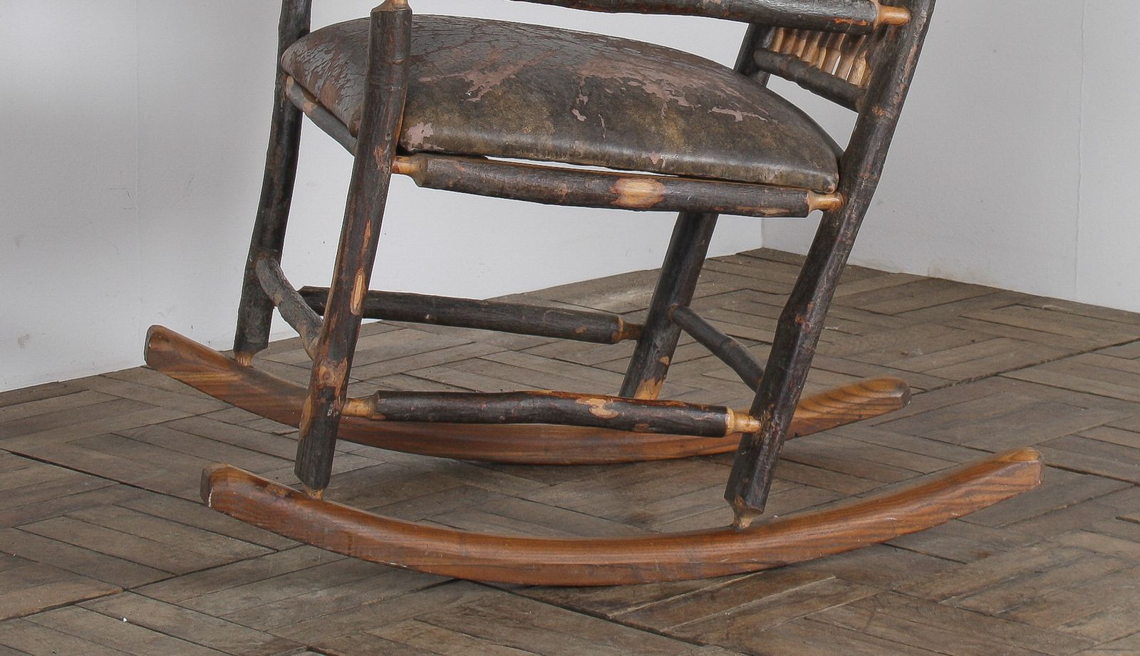 1585.0 Antique American Stick Back Rocking Chair With Distressed Patina And Leather Seat photo