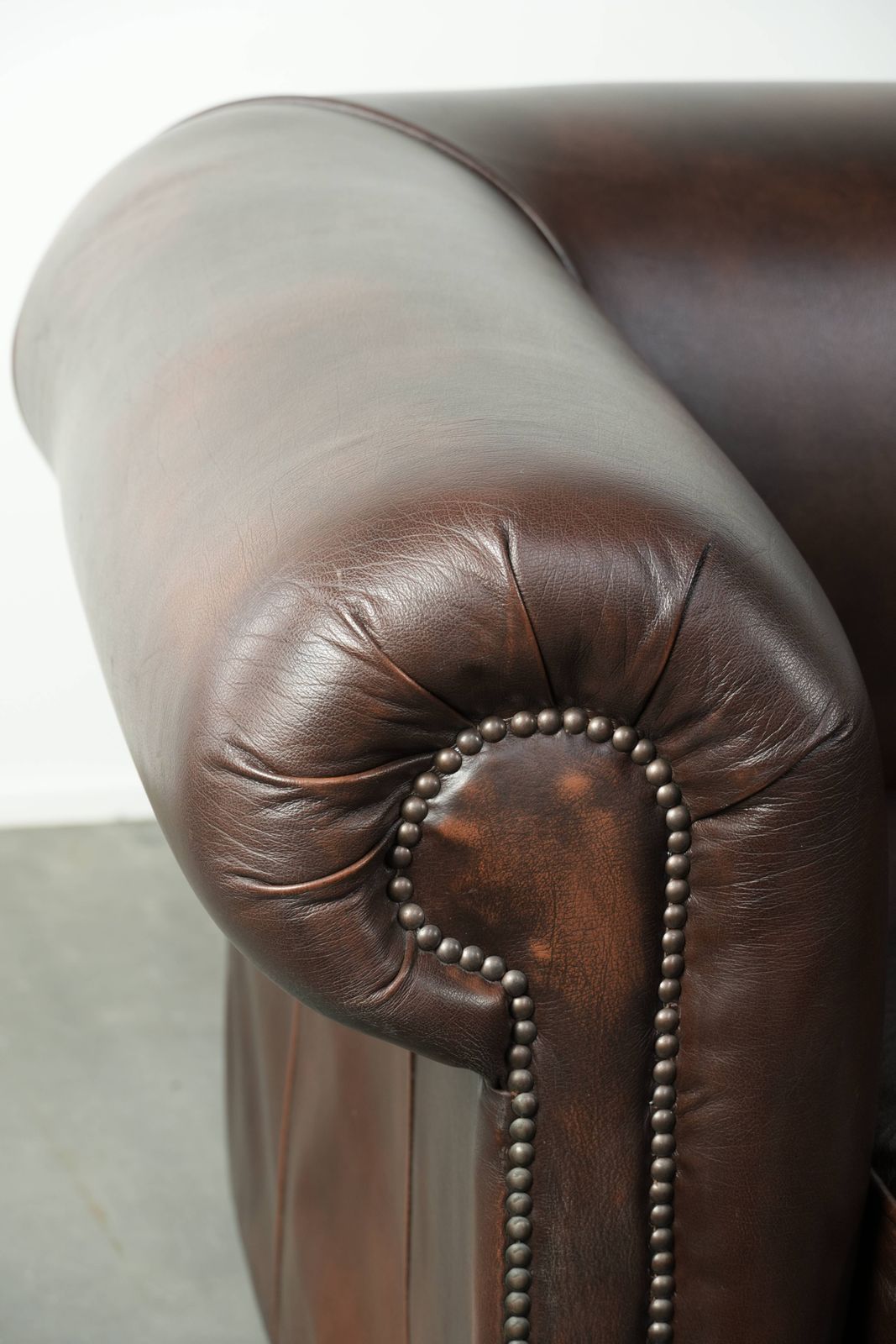Furniture Luxurious Brown Smooth Cowhide Chesterfield Sofa With A Timeless English Look. photo