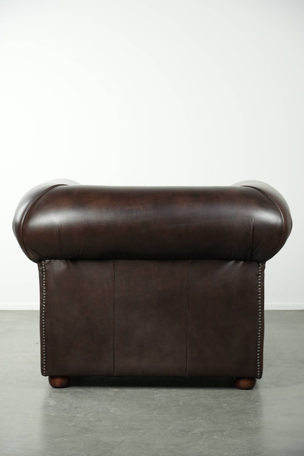 Luxurious Brown Cowhide Chesterfield Armchair With A Timeless English Look. photo Furniture
