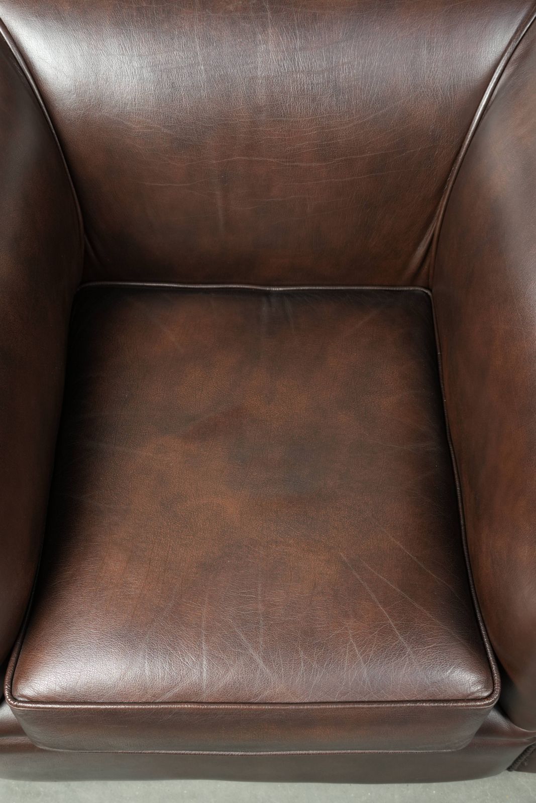 Luxurious Brown Cowhide Chesterfield Armchair With A Timeless English Look. photo vinterior