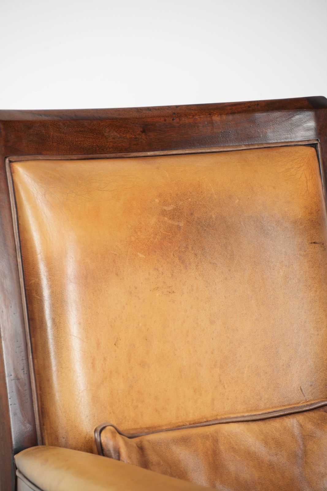 834.0 Comfortable Cognac Colored Art Deco Design Armchair Made Of Sheepskin Combined With Wood, With A High Back. photo