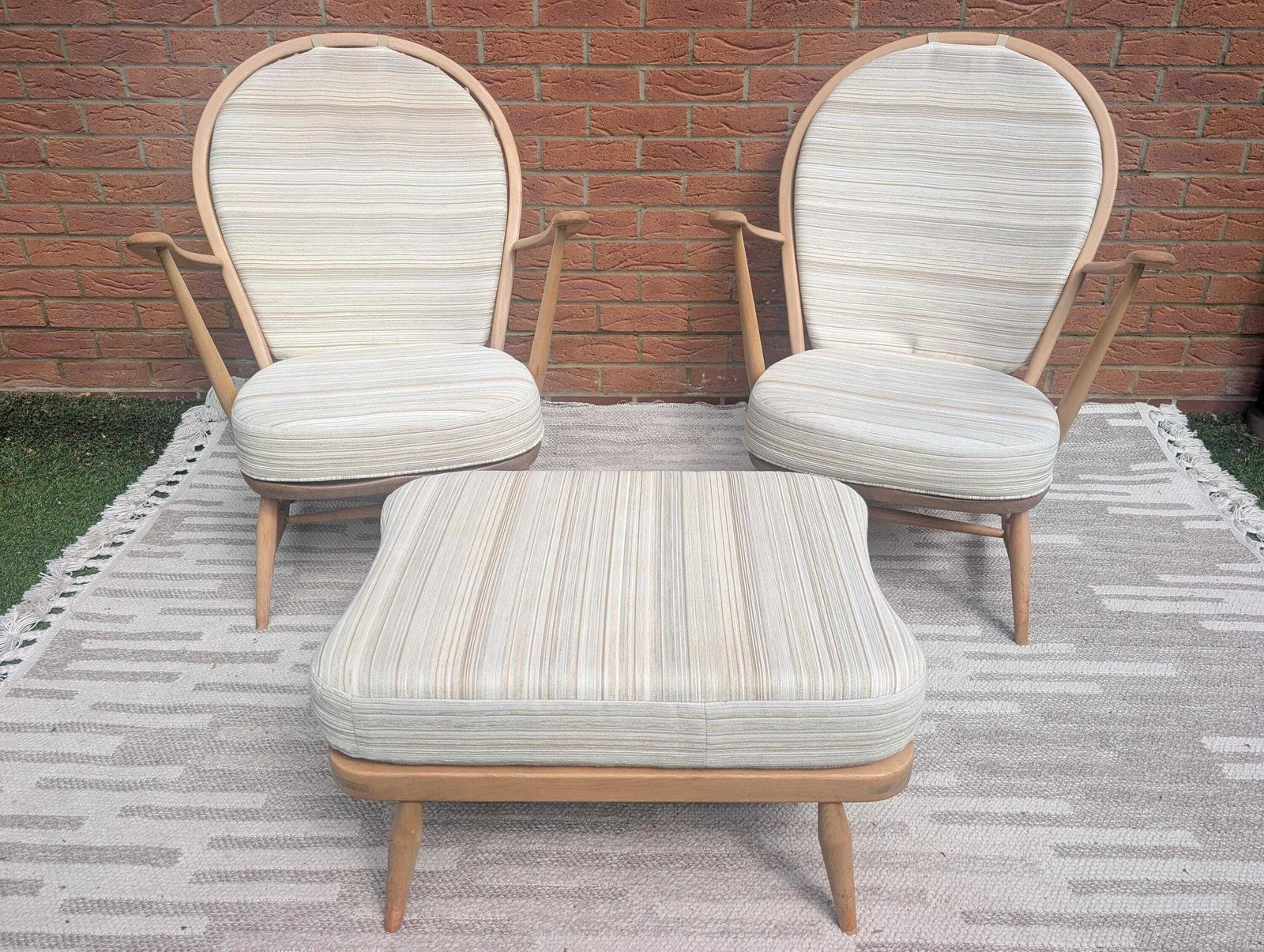 photo for sale Pair Of Ercol 317 Grandfather Armchairs In Blonde Finish With Matching Footstool Including Original Cushions And Covers By Lucian Ercolani.