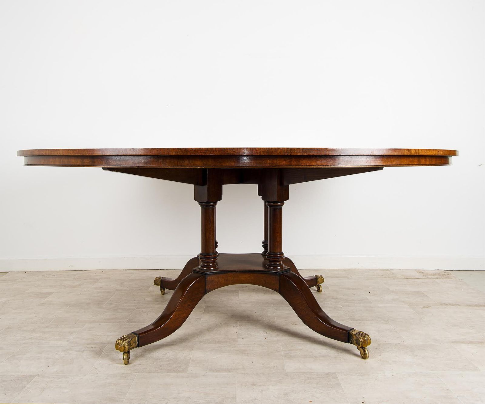 Large Regency Style Flame Mahogany Circular Dining Table With Brass Lion Paw Castors photo Furniture
