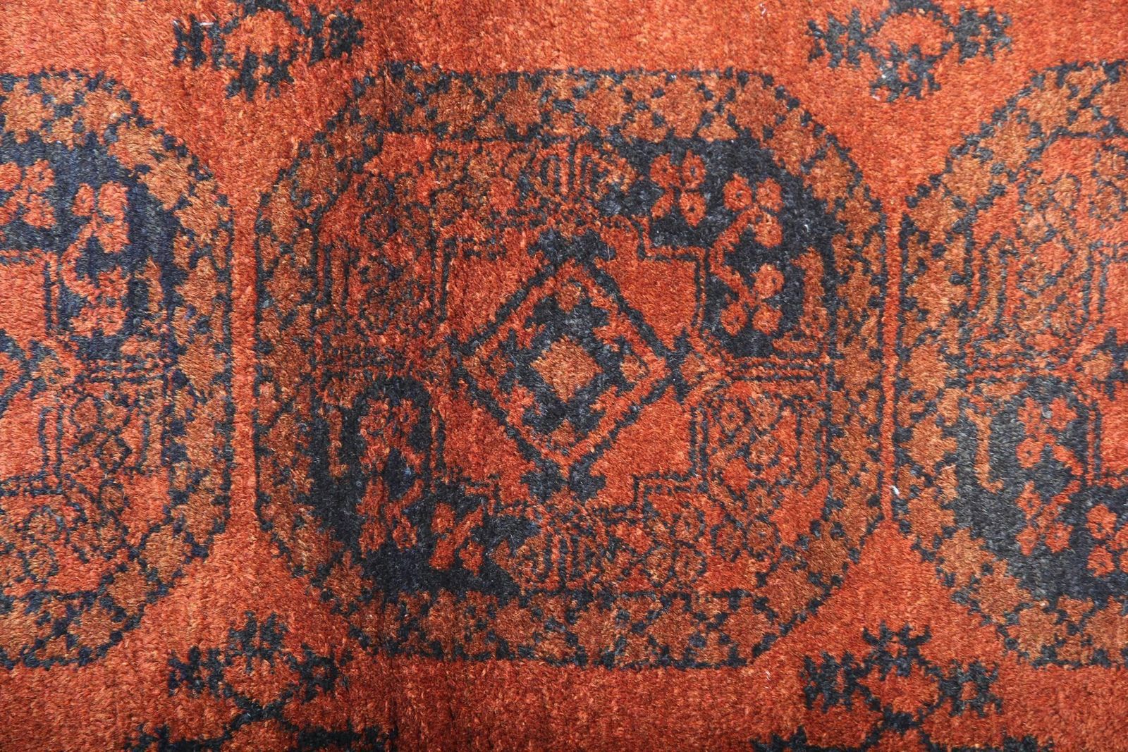 Handgemaakt tapijt, oranje Afghaans vloerkleed, oosters wollen vintage kleed photo Textiel
