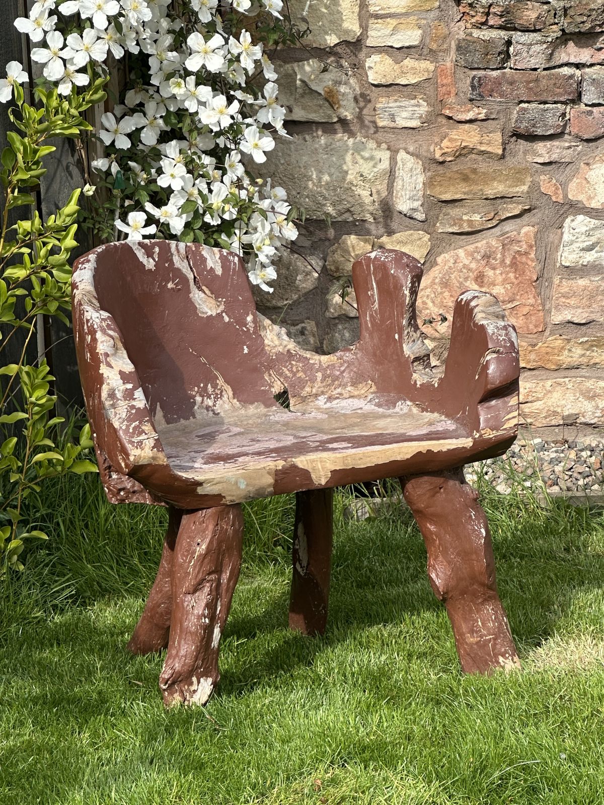 A Root Garden Seat With Weathered Paint Finish photo furniture