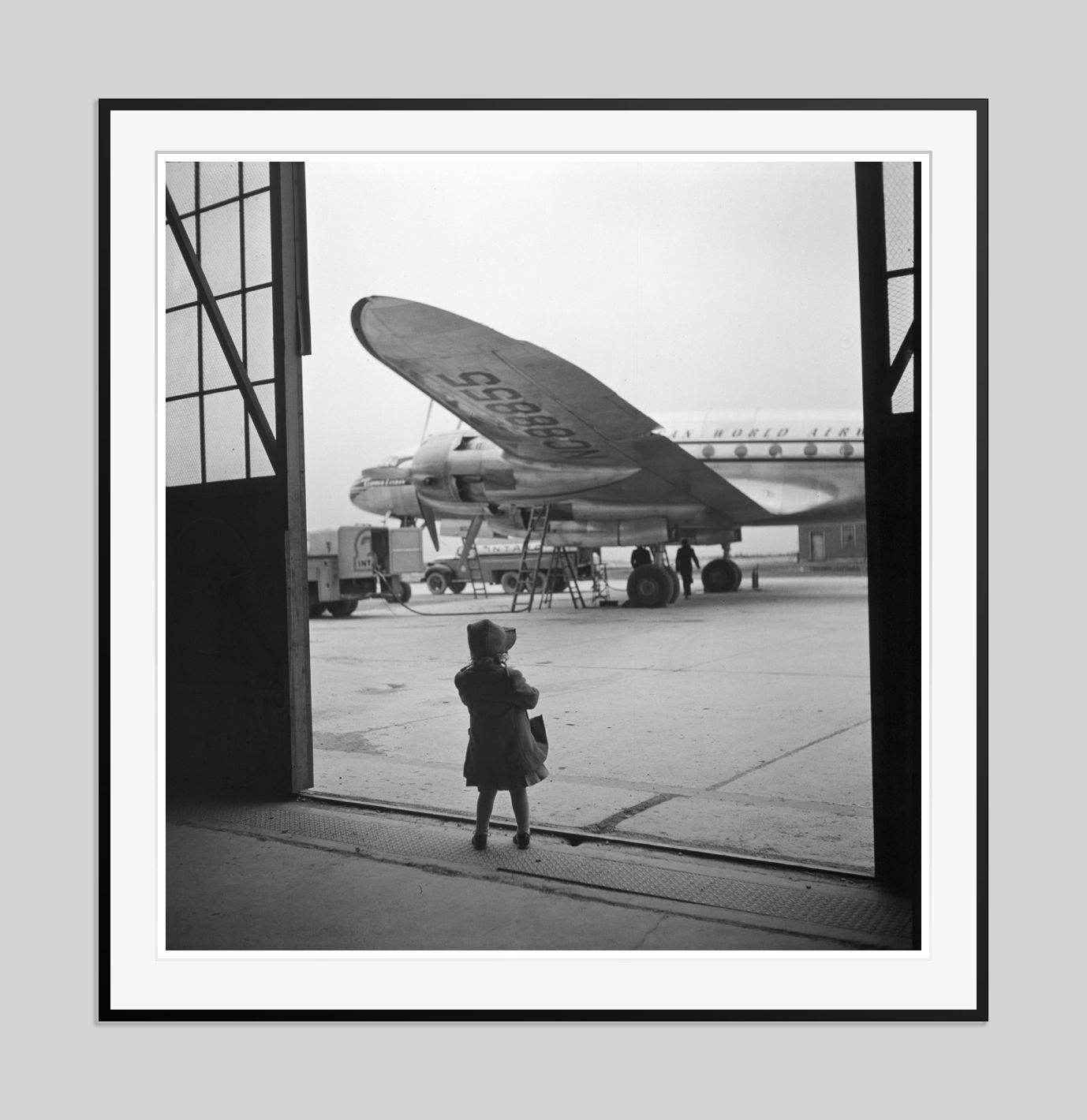 Toni Frissell 'Young Traveller' Archival Pigment Print Framed In Black photo furniture