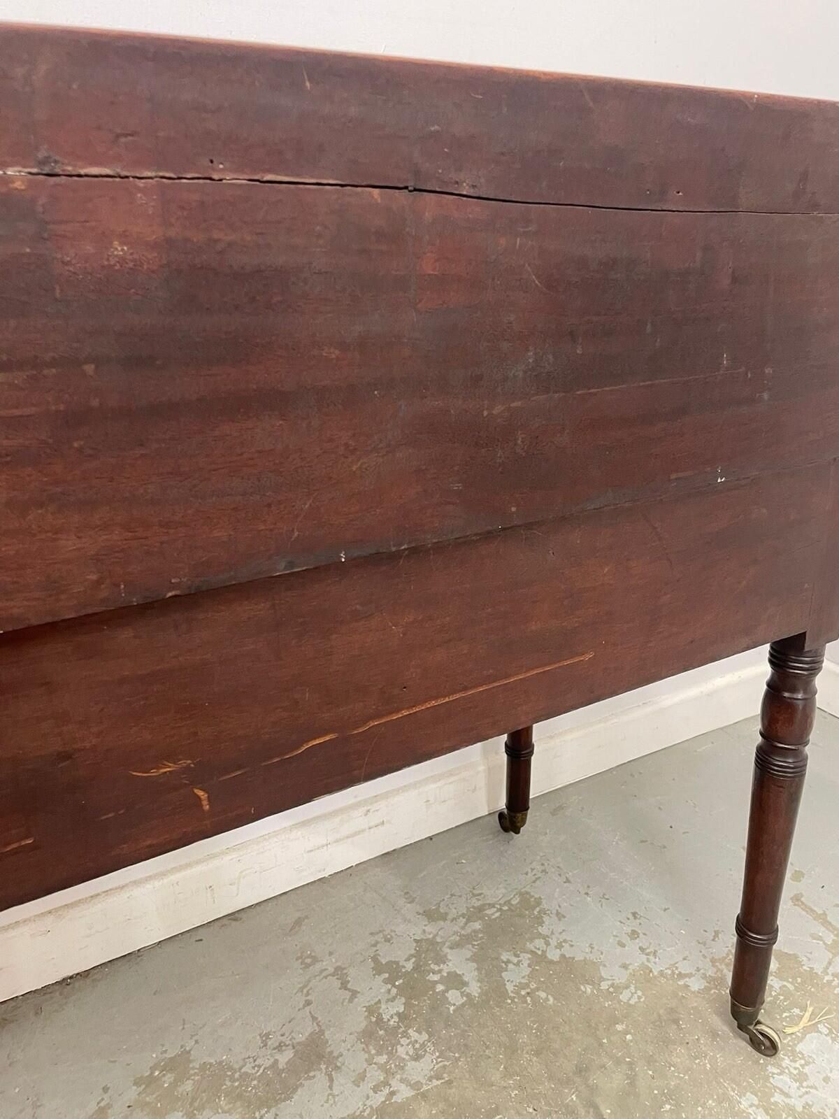 photo vintage Antique Writing Desk With Raised Back & Drawers Desk On Castors.