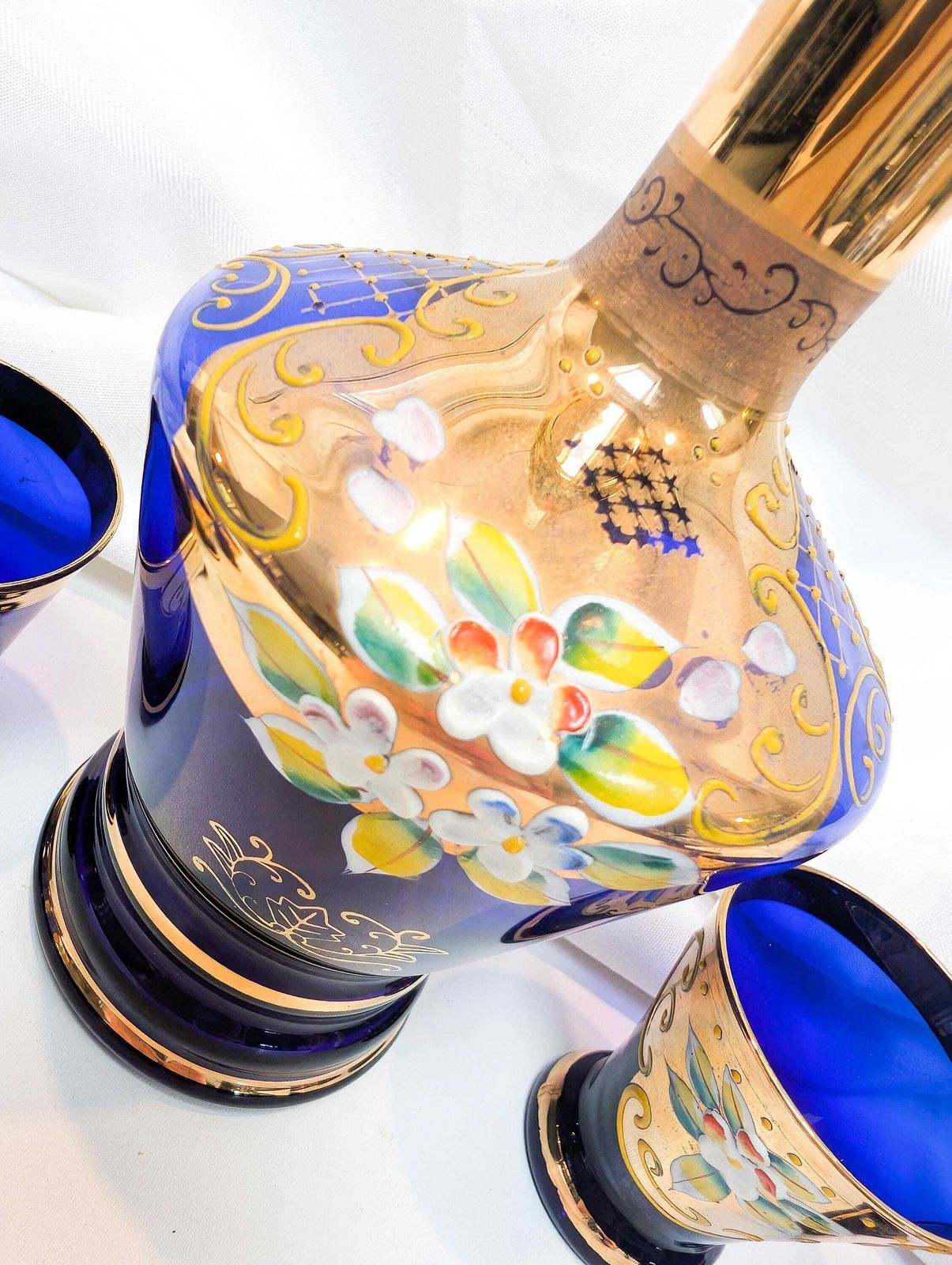 155.0 Murano Mid Century Cobalt Blue Glass Decanter And Six Liqueur/Shot Glasses. All Pieces Feature 24 Karat Gold Decoration And Hand Painted. photo