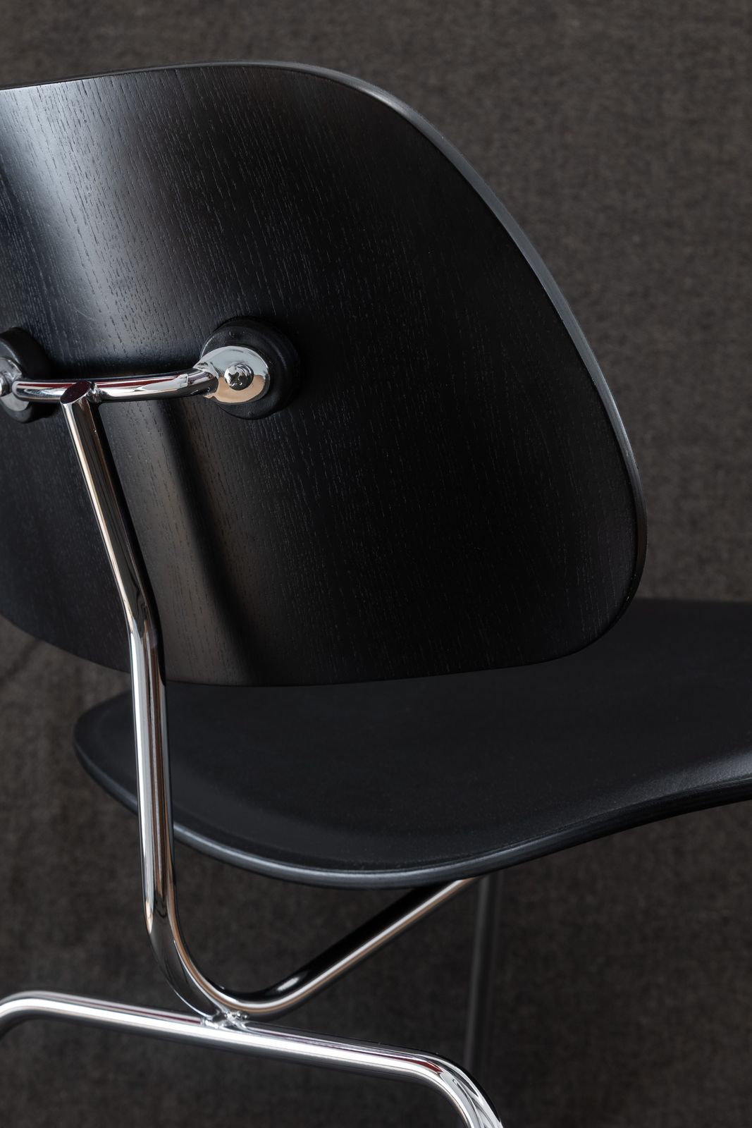 photo buy Vitra Eames Lcm Lounge Chair In Black Ash & Black Leather