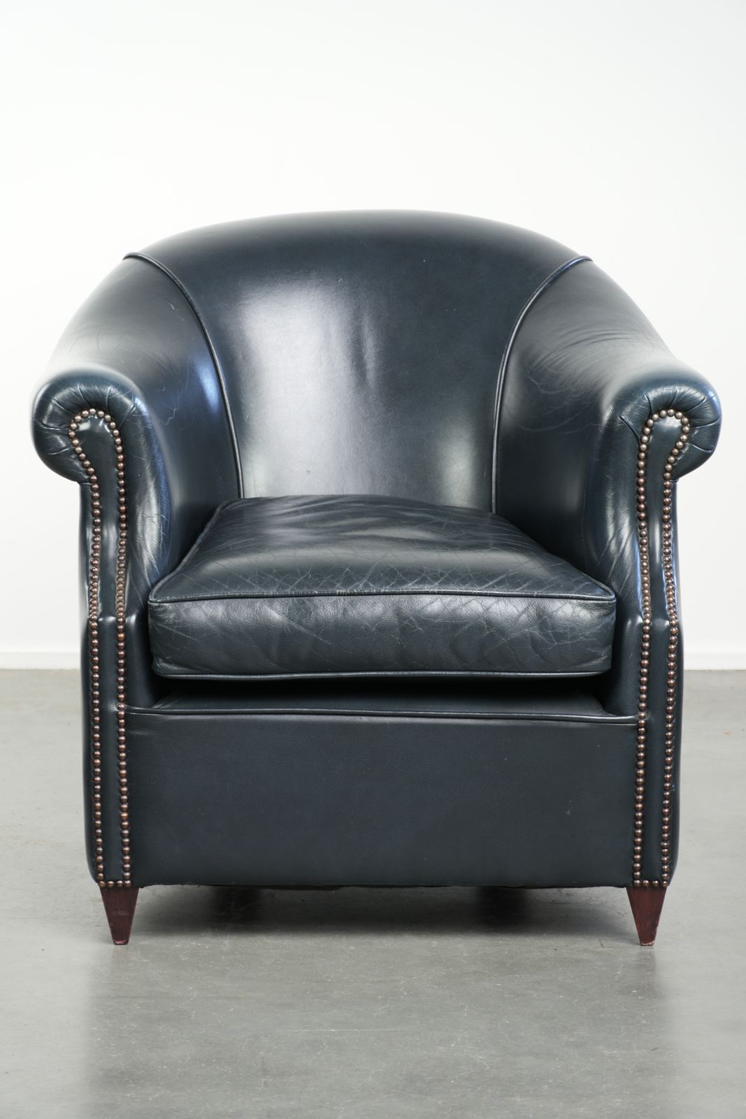 Beautiful And Comfortable Dark Blue Cowhide Leather Club Armchair With A Unique And Timeless Design photo furniture
