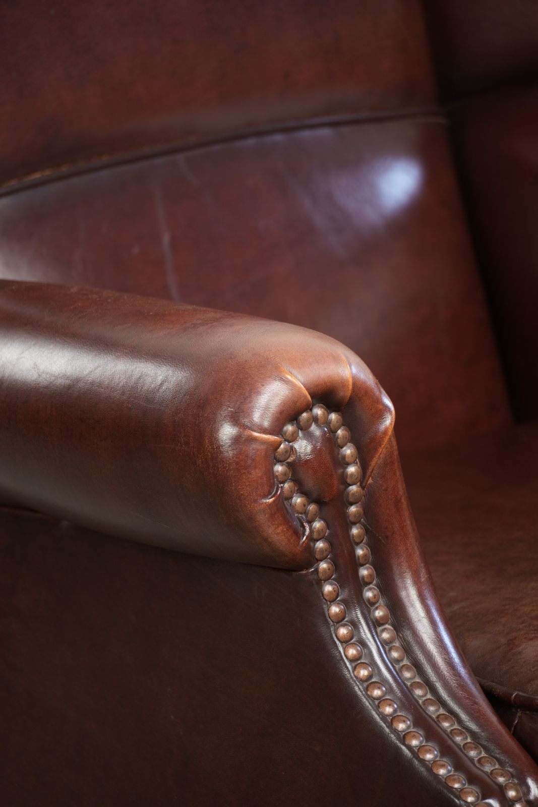photo buy Elegant Vintage Sheepskin Wing Armchair With A Timeless English Look, Finished With Decorative Nails.
