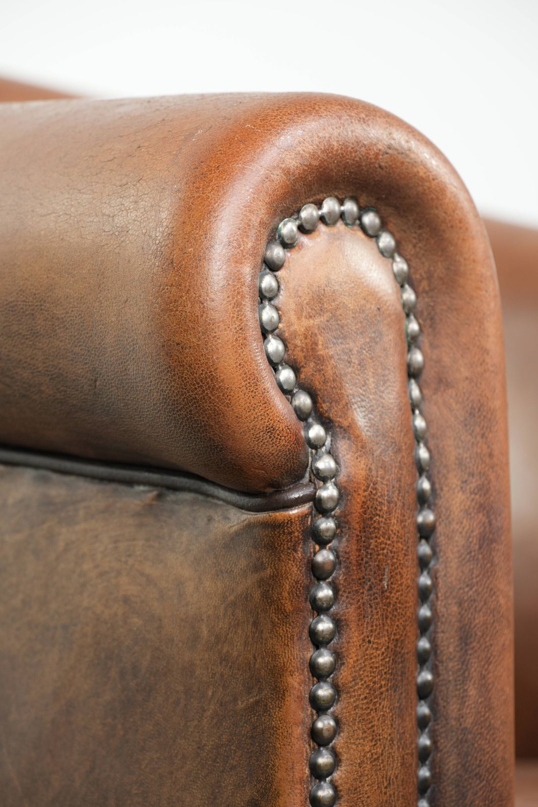895.0 Characterful And Comfortable Sheepskin Club Armchair With A Beautiful Patina And A Refined Finish With Black Piping. photo