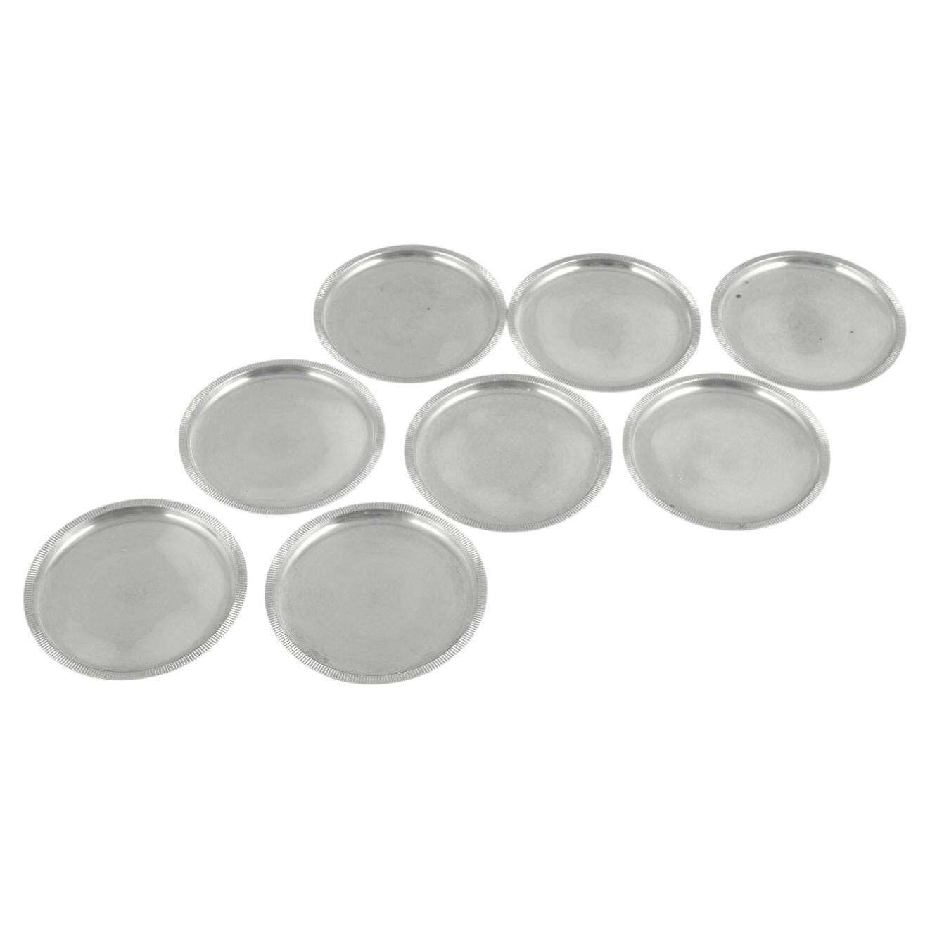 Just Andersen, Danemark. Ensemble de huit sous-verres en étain, bord cannelé. Années 1930