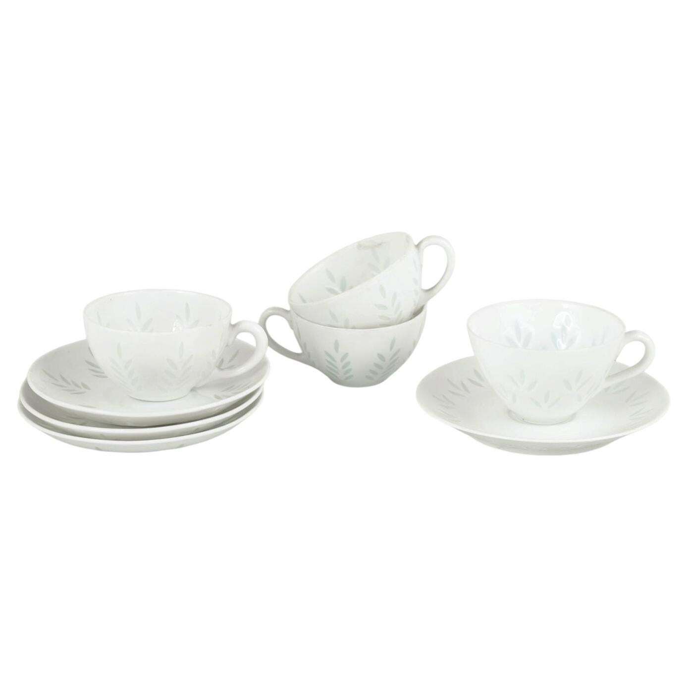 Friedl Holzer Kjellberg For Arabia. Four Porcelain Demi Tasse Cups With Saucers.