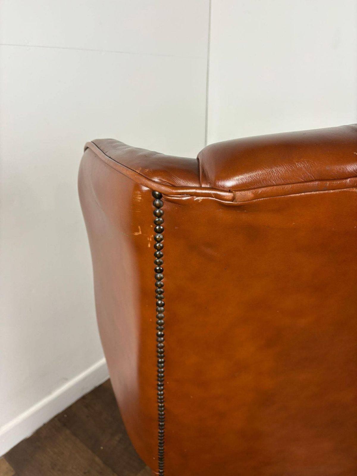 photo furniture Tan Leather Chesterfield Style Wingback Armchair