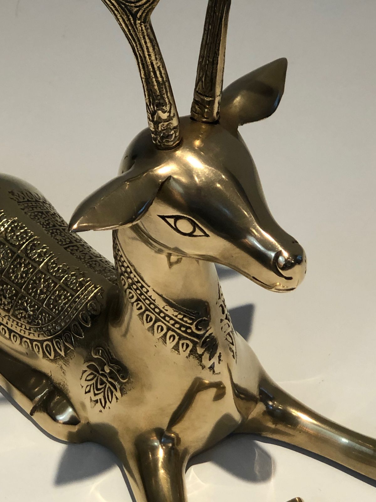 photo furniture Pair Of Bronze Reclining Deer Engraved With Shamanic Motifs. French Work. Circa 1970