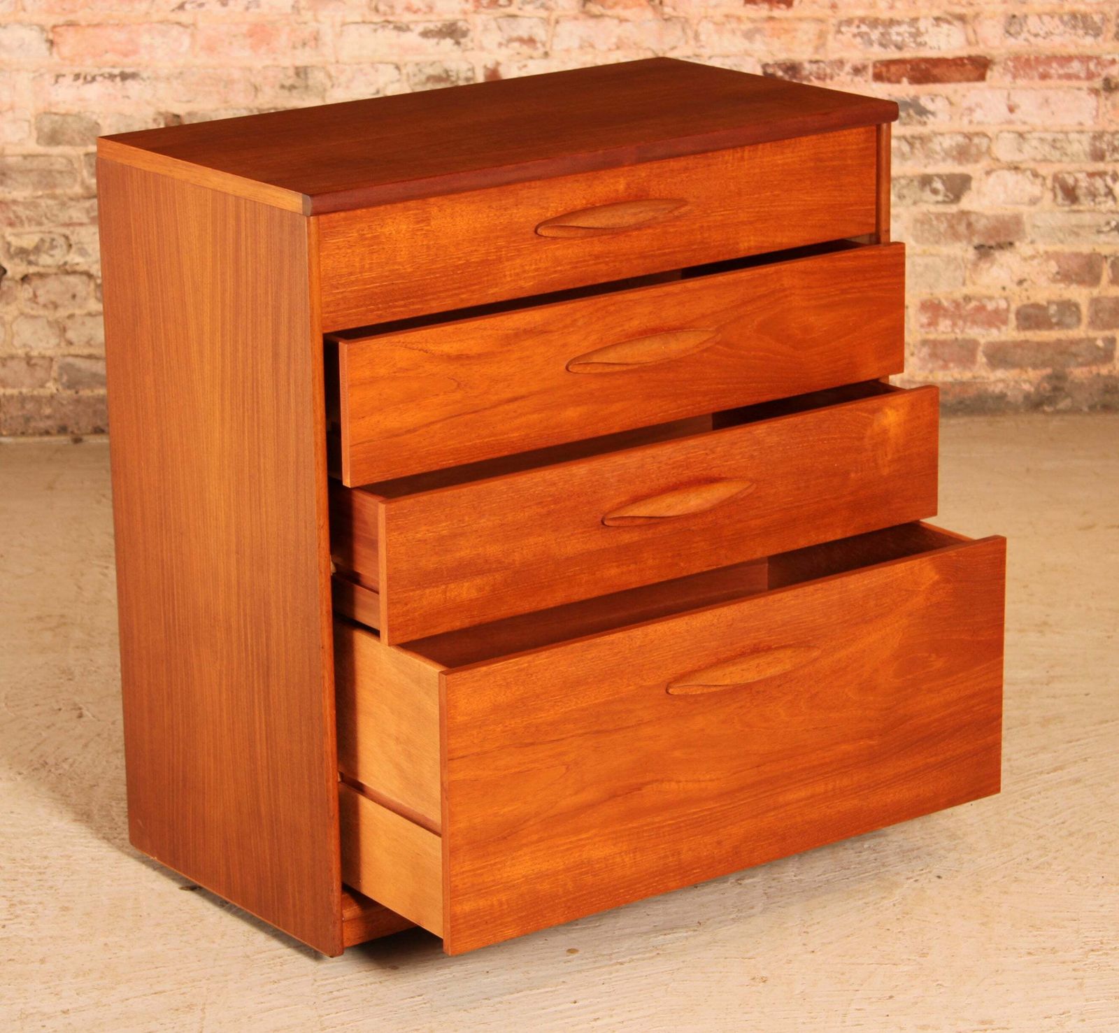 Mid Century Teak Chest Of 4 Drawers On Casters By Austinsuite, Circa 1960s photo vintage