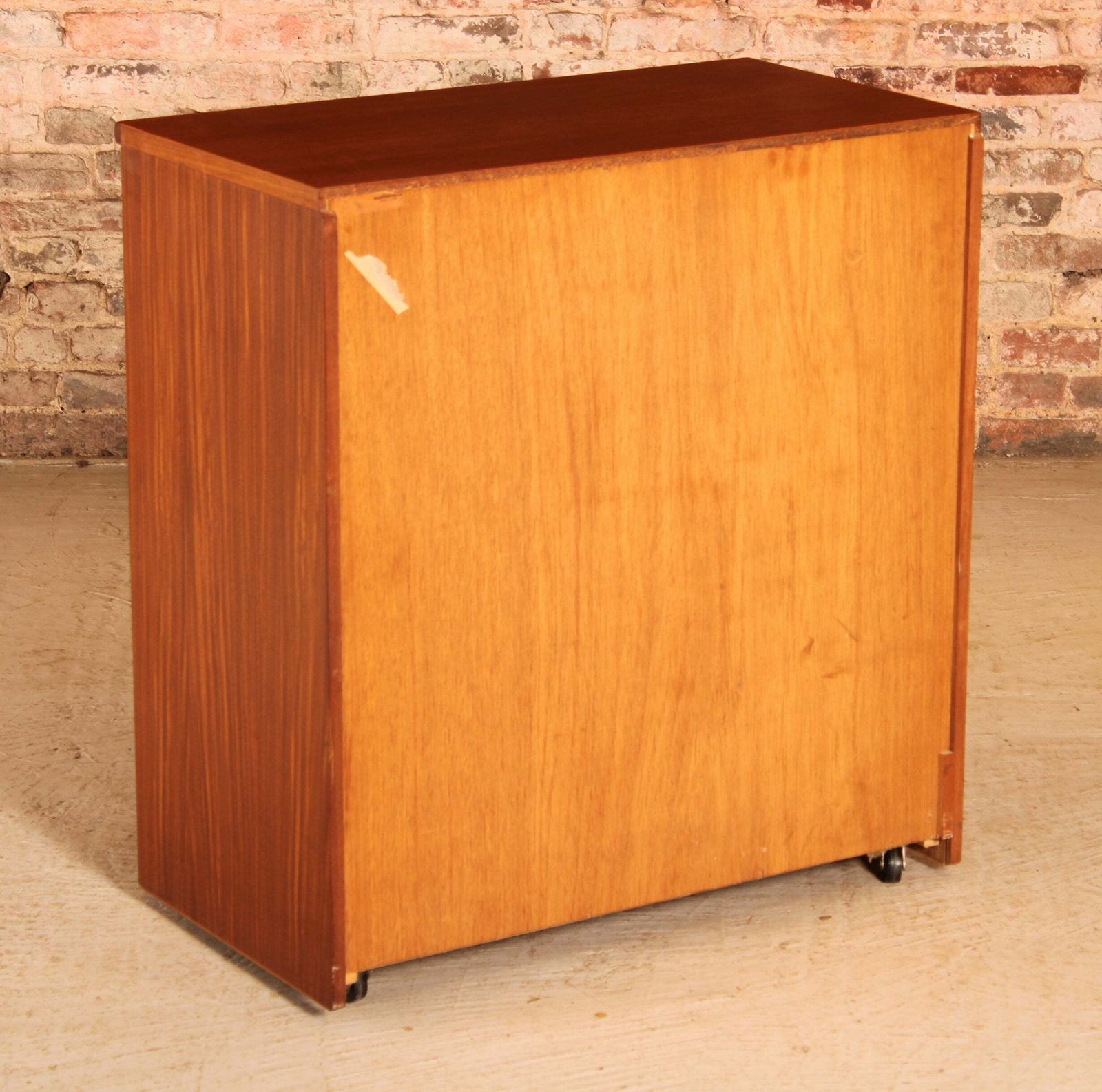 photo furniture Mid Century Teak Chest Of 4 Drawers On Casters By Austinsuite, Circa 1960s