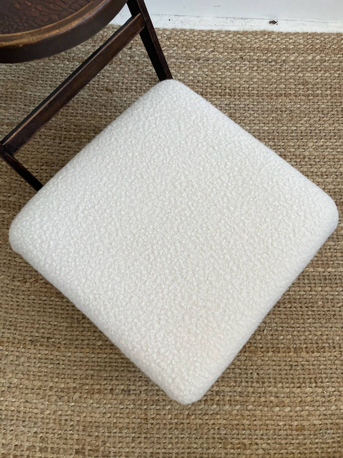 Chunky Low Lying Footstool With Tapered Legs And Cream Boucle Fabric photo vinterior