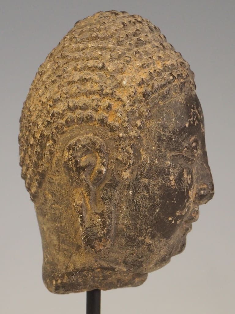 A Stucco Buddha Head Fragment photo furniture