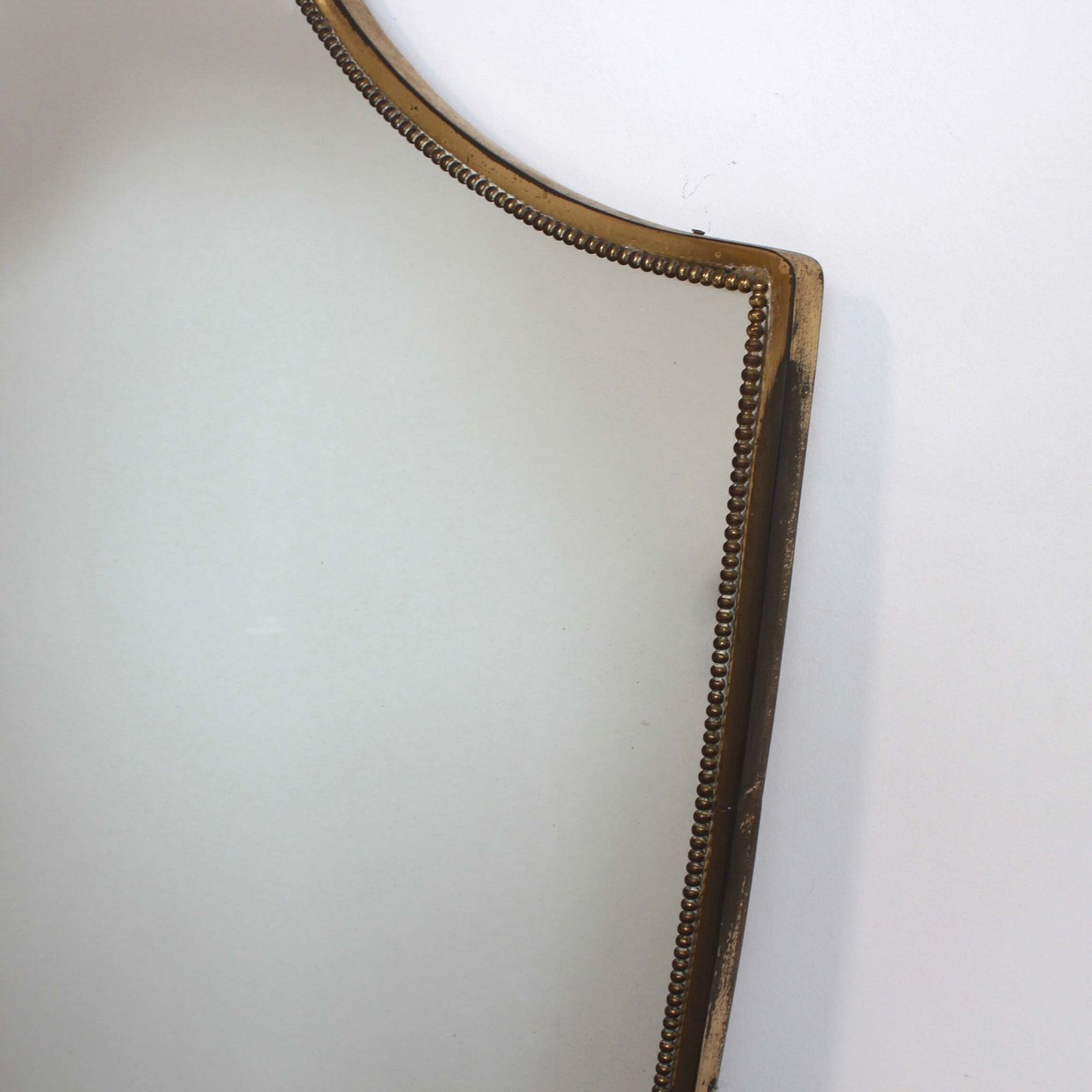 3000.0 Mid Century Italian Wall Mirror With Beaded Brass Frame And Hammered Decoration (Circa 1950s) photo