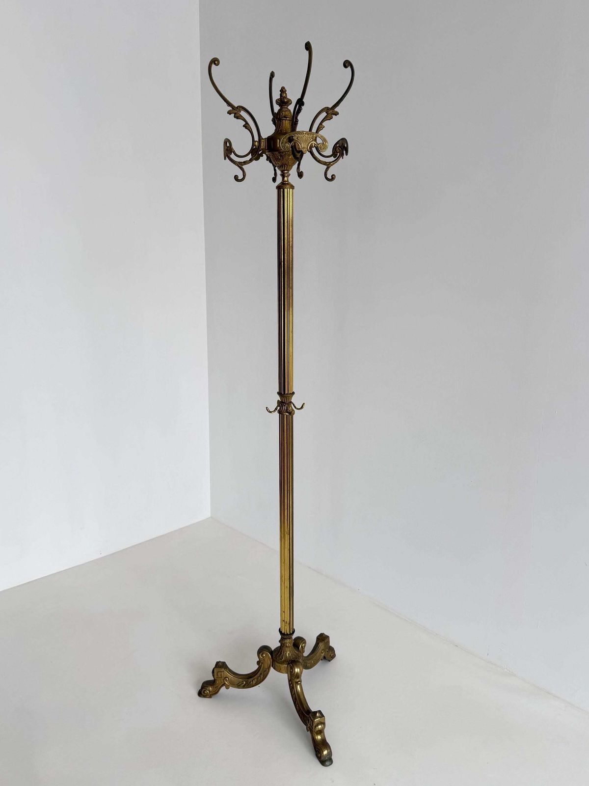 Vintage Brass Coat Rack With Rotating Crown And Decorative Three Leg Base photo furniture