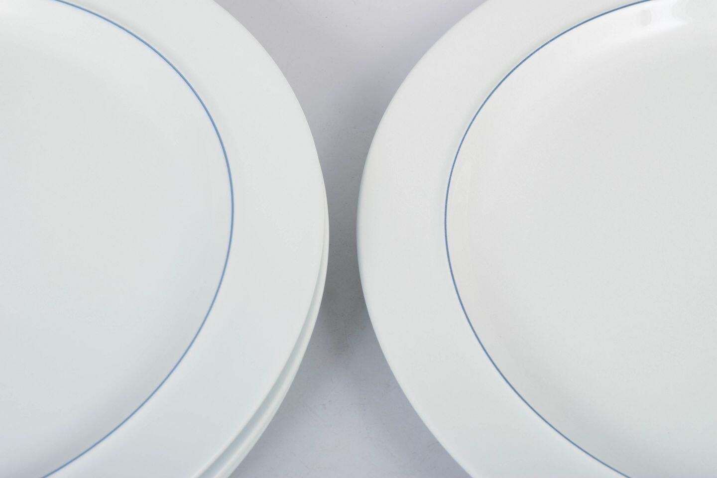 Grethe Meyer, Royal Copenhagen. Set Of Four Blue Line Dinner Plates In Faience photo for sale