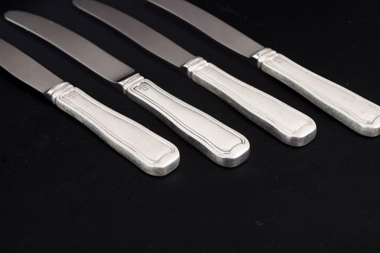 Georg Jensen. Set van vier fruitmessen in roestvrij staal en sterling zilver. photo for sale