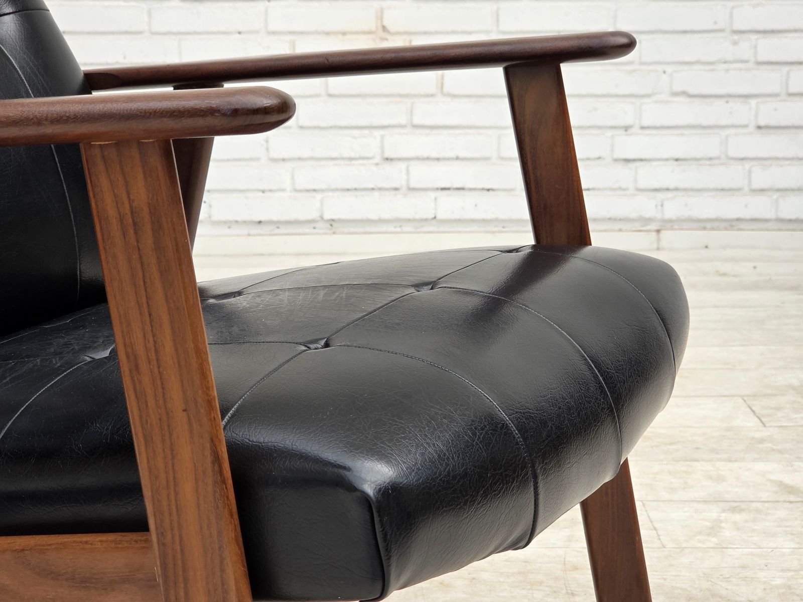 Ca. jaren 1970, Deense fauteuil, zwart kunstleer, teakhout. photo for sale