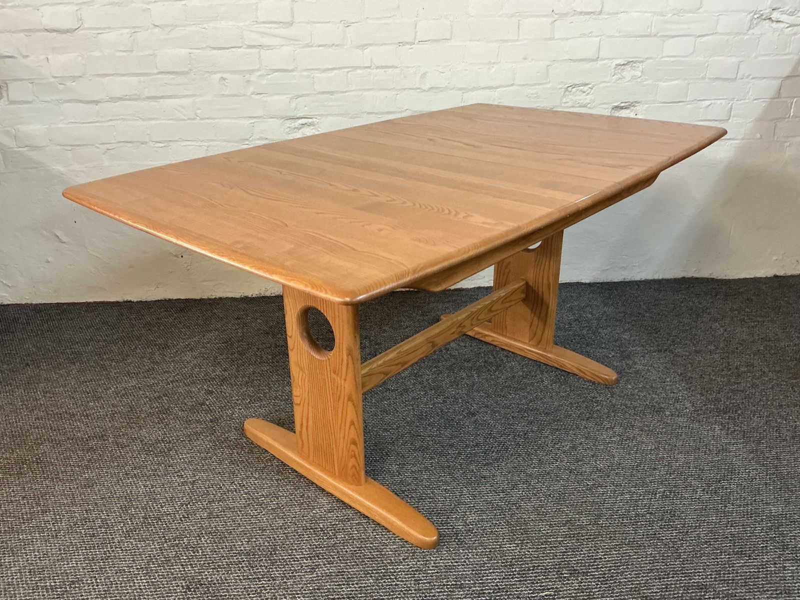 photo furniture Ercol Windsor Extending Dining Table In Light Finish.