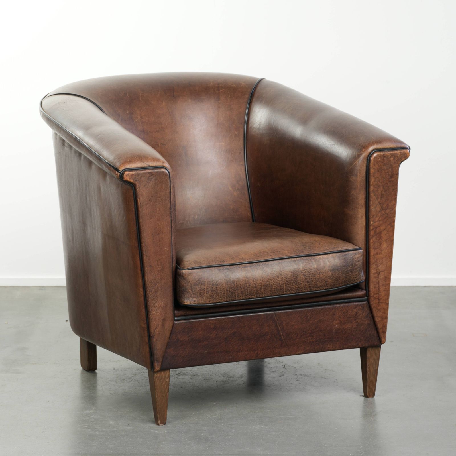Nice And Sleek Art Deco Designed Sheepskin Club Armchair Finished With Black Piping