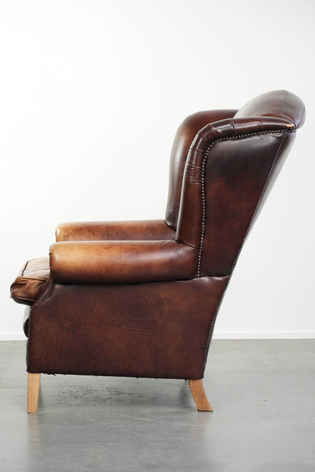 Comfortable English Style Cowhide Wing Armchair With A Beautiful Warm Color Scheme And A Characterful Appearance. photo 847.0