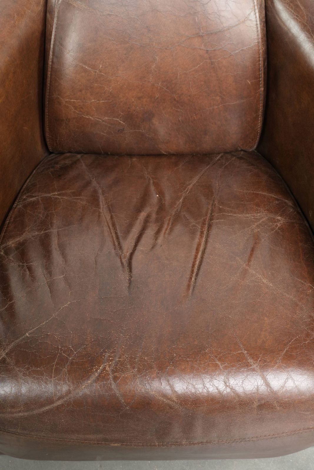 Characterful And Robust Dark Cognac Brown Cowhide Leather Aviator Design Armchair With An Interesting Shape photo vinterior