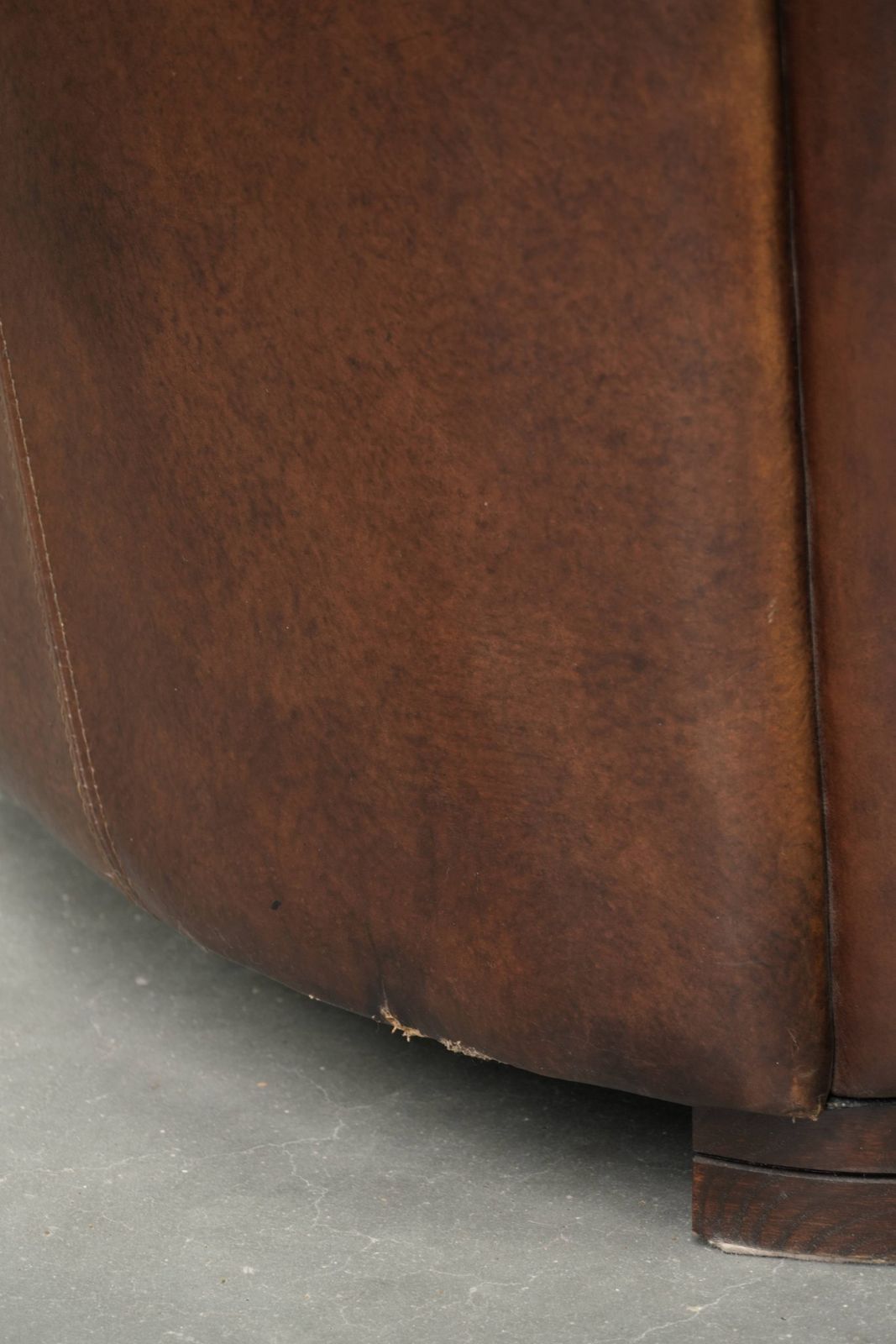 photo vintage Characterful And Robust Dark Cognac Brown Cowhide Leather Aviator Design Armchair With An Interesting Shape