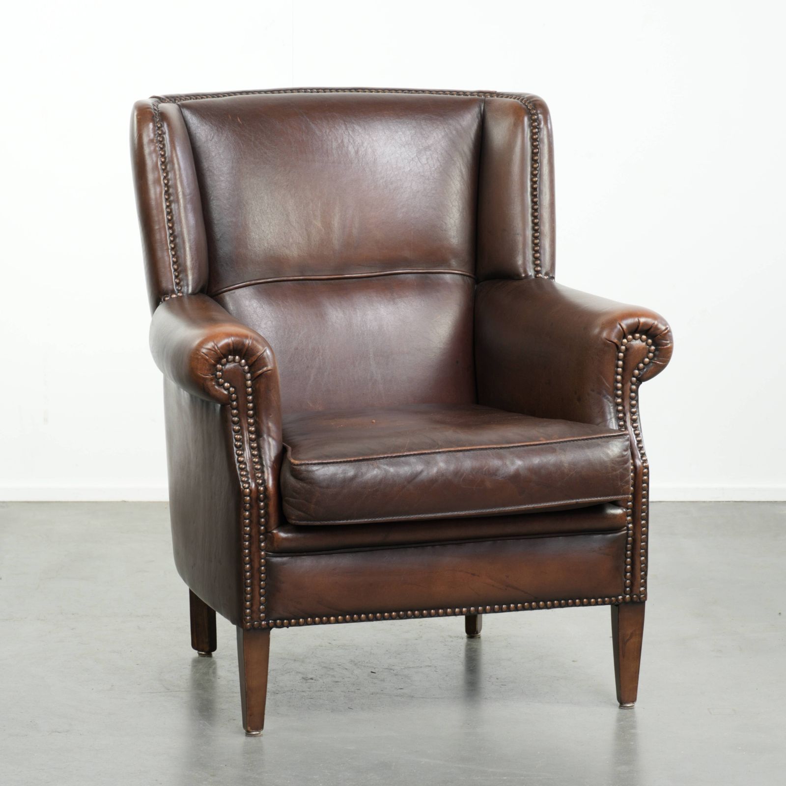 Beautiful, Subtle Sheepskin Wing Armchair With A Deep Cognac Color And A Comfortable Seat.
