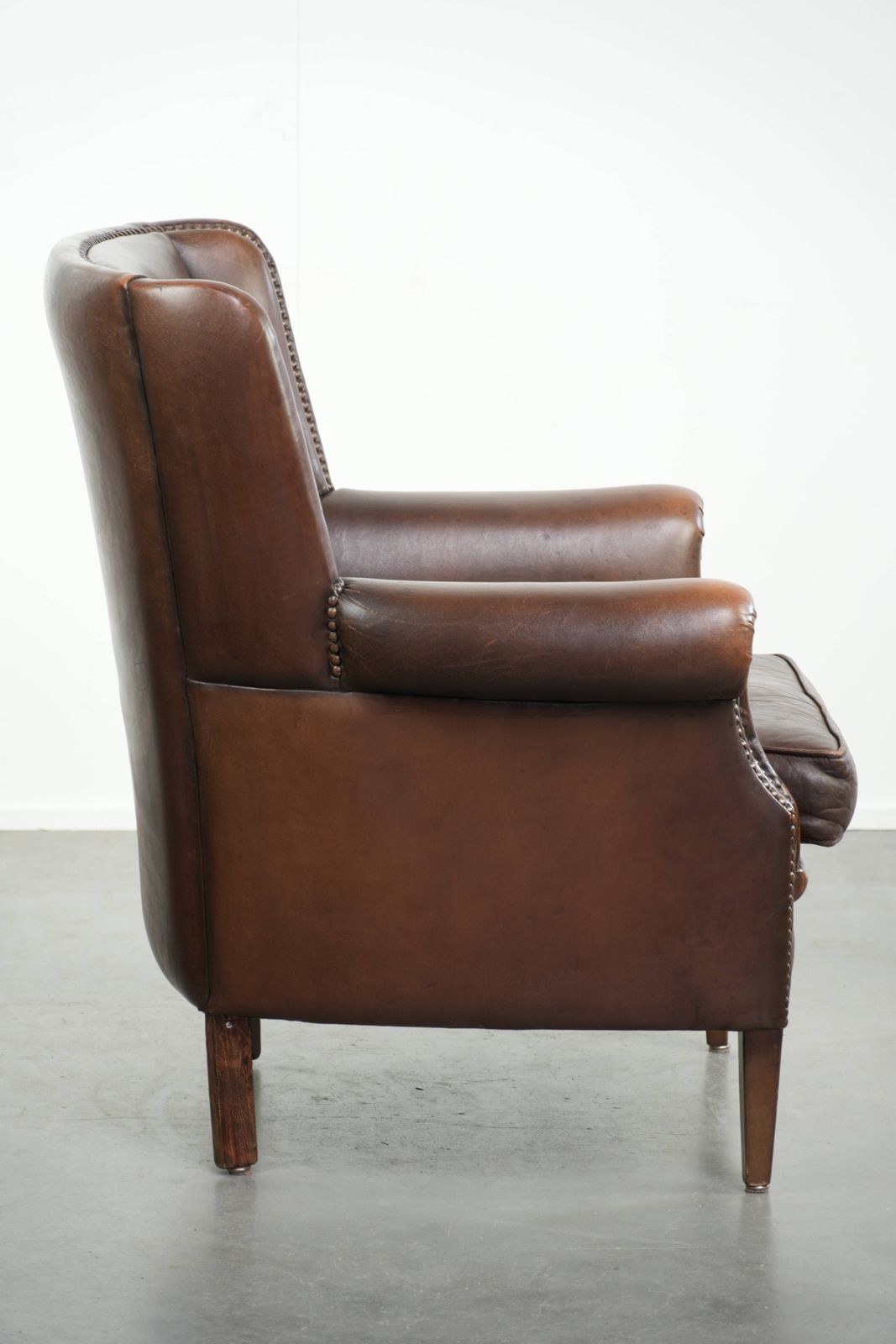 Beautiful, Subtle Sheepskin Wing Armchair With A Deep Cognac Color And A Comfortable Seat. photo for sale